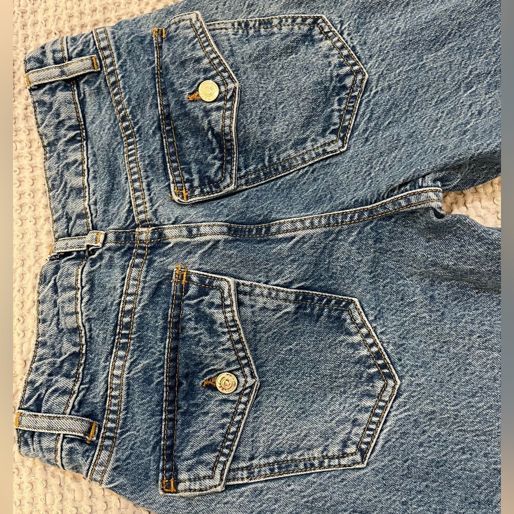 This is ASOS DESIGN jeans - cotton blend flare, midwash, with button pockets